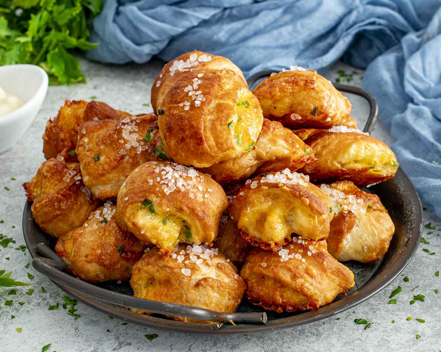 Soft pretzel bites stuffed with cheese and jalape&ntilde;o, baked until golden and glossy, ready for dipping.