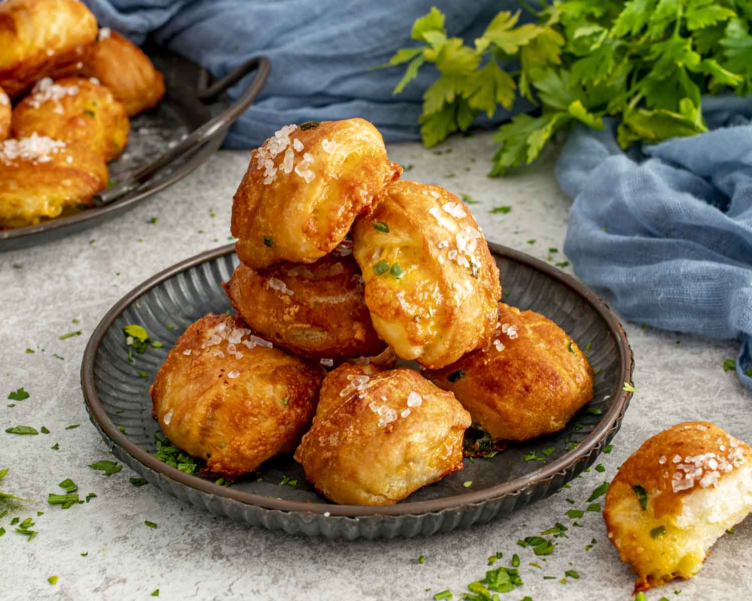 Golden pretzel bites filled with melted cheddar and jalape&ntilde;o, sprinkled with coarse salt and fresh herbs.