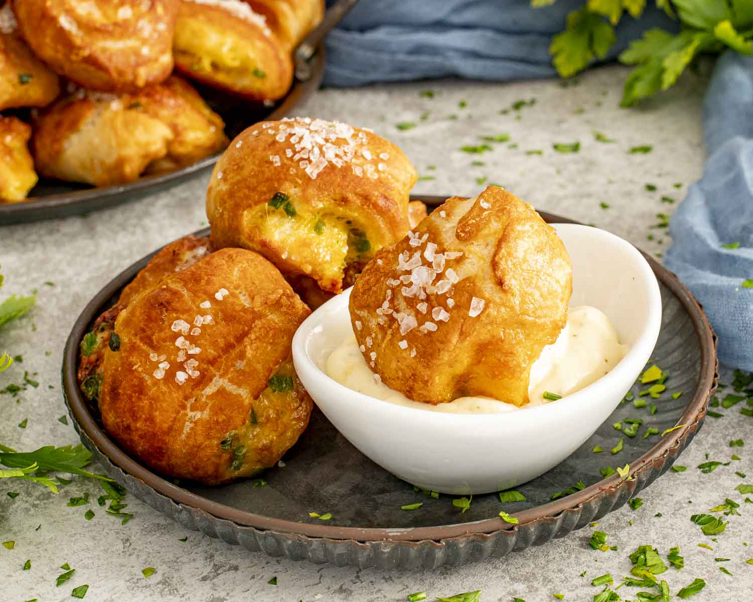 Cheesy jalape&ntilde;o pretzel bites served warm with a small bowl of creamy dipping sauce on the side.