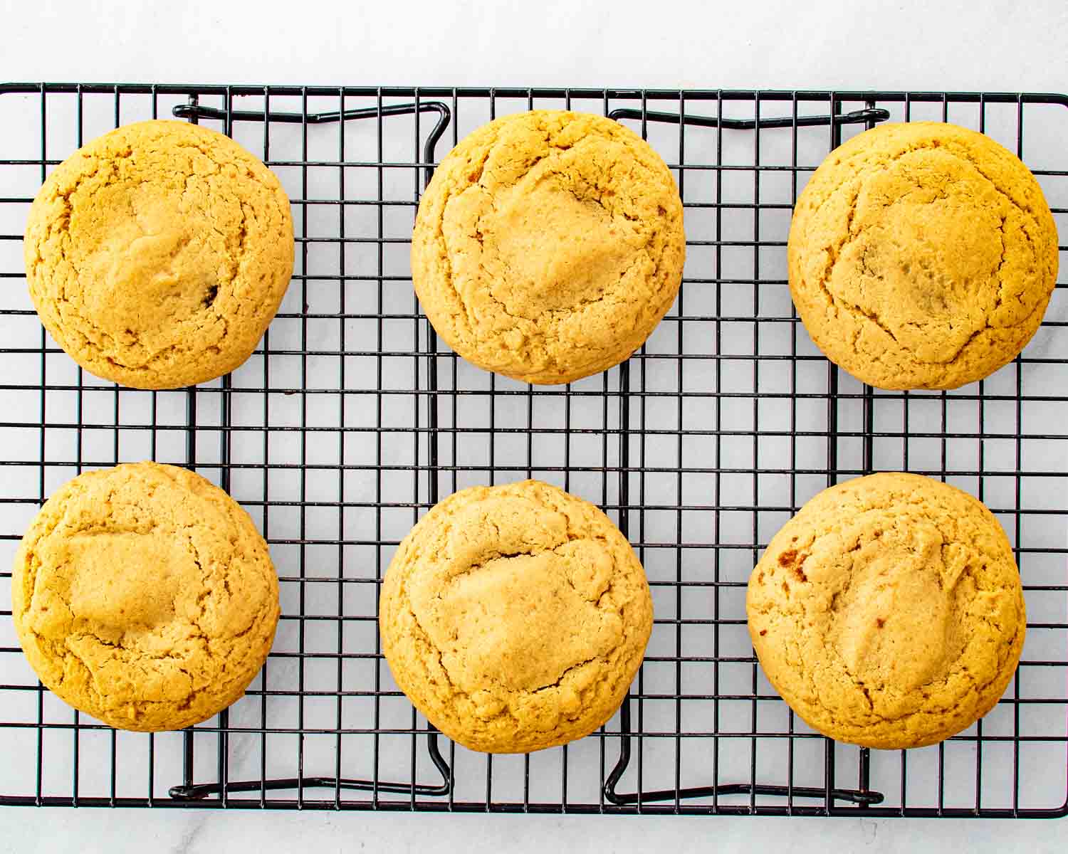 process shots showing how to make cinnamon roll cookies with cream cheese glaze.