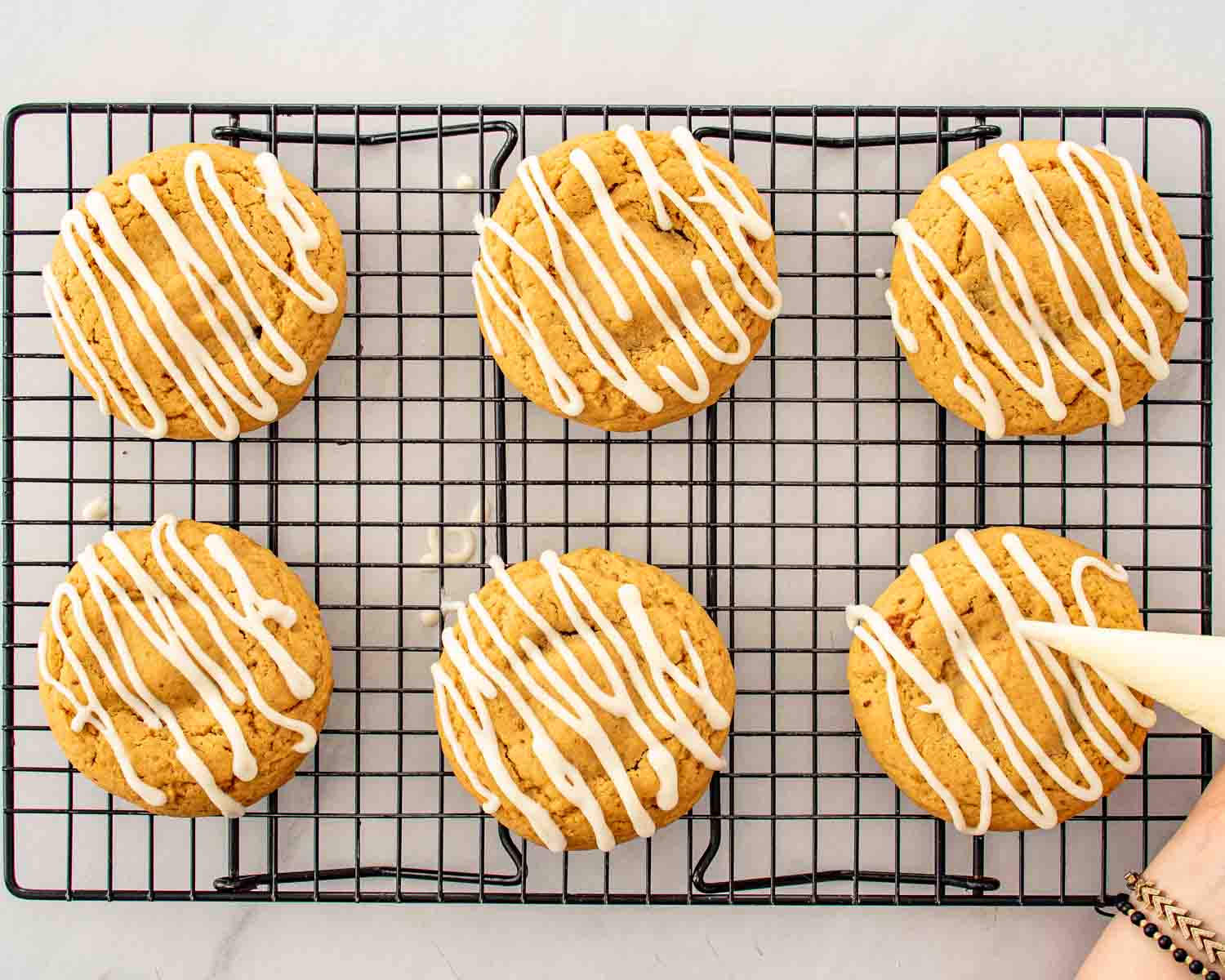 process shots showing how to make cinnamon roll cookies with cream cheese glaze.