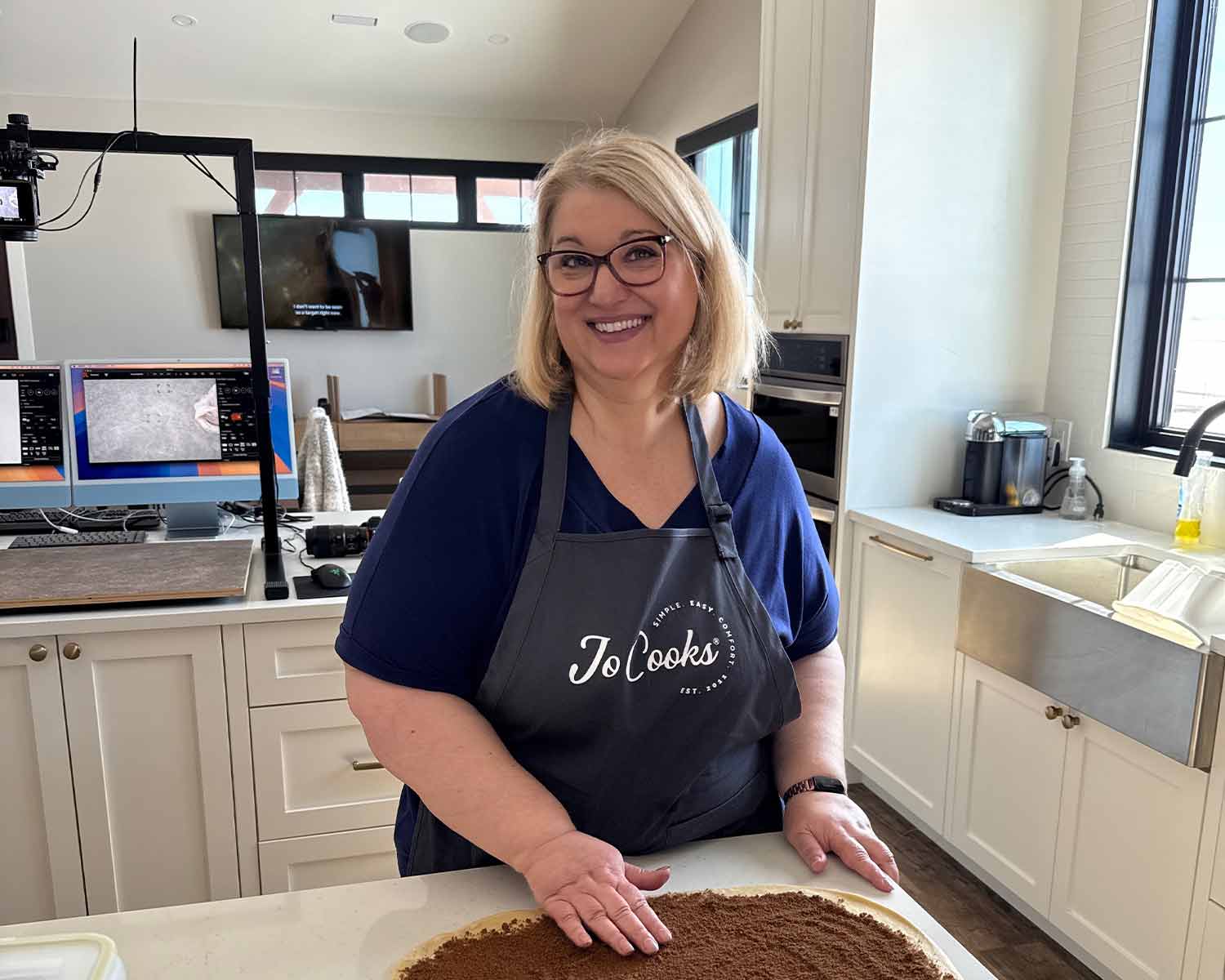 Jo making cinnamon rolls.