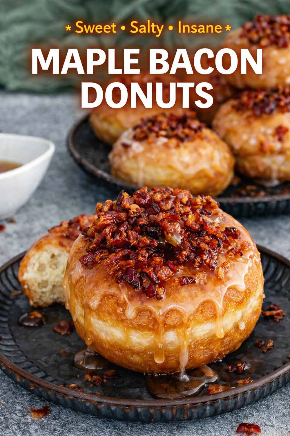 Pinterest graphic featuring close up of a bacon topped donut with text Sweet Salty Insane Maple Bacon Donuts.