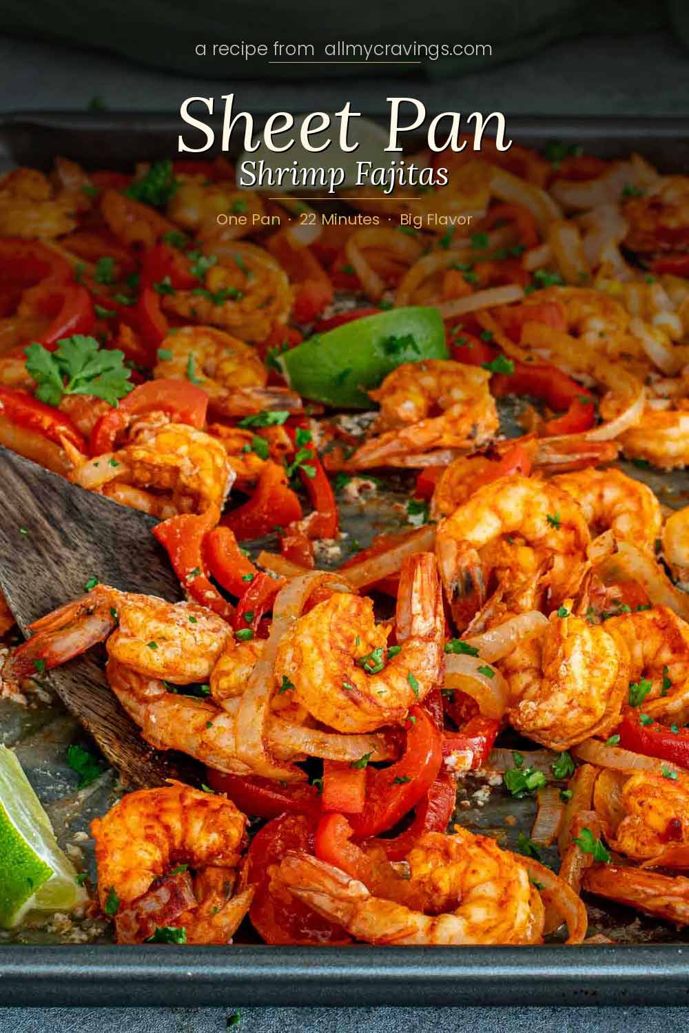 Elegant Pinterest pin for sheet pan shrimp fajitas with seasoned shrimp, roasted red peppers, onions, and lime wedges on a dark sheet pan, with script text overlay reading Sheet Pan Shrimp Fajitas.
