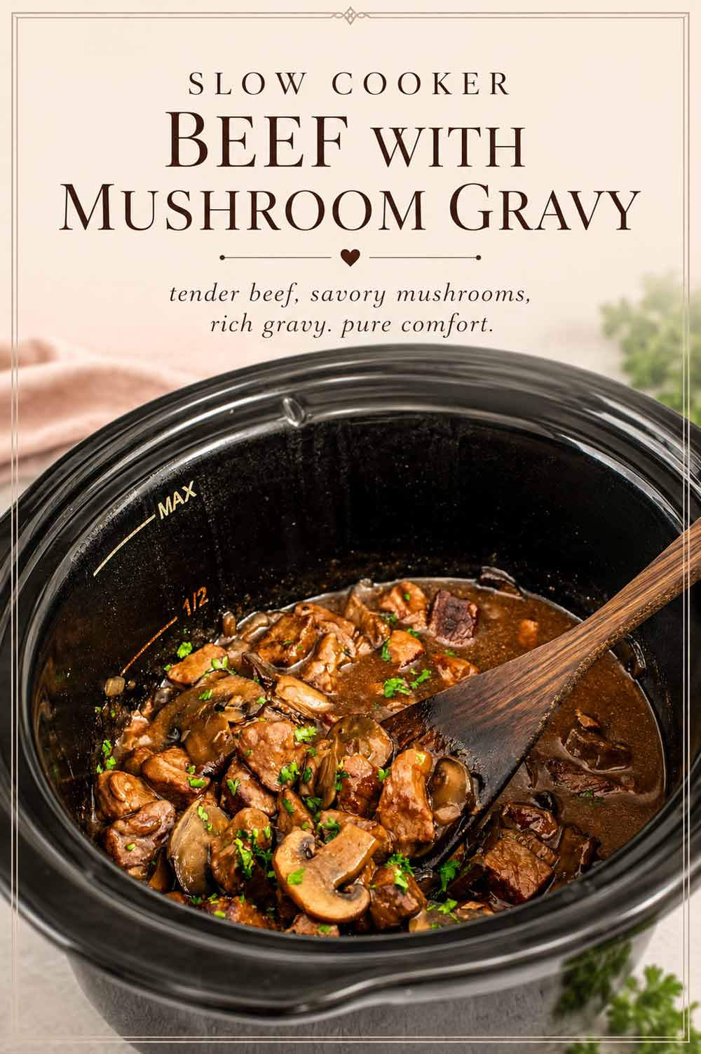 Slow cooker beef with mushroom gravy in a black slow cooker with a wooden spoon and text overlay on a cream background.