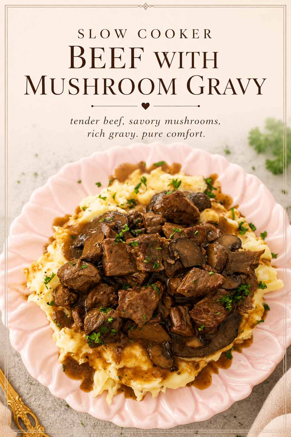 Tender slow cooker beef and mushroom gravy piled over mashed potatoes on a pink plate with elegant text overlay.