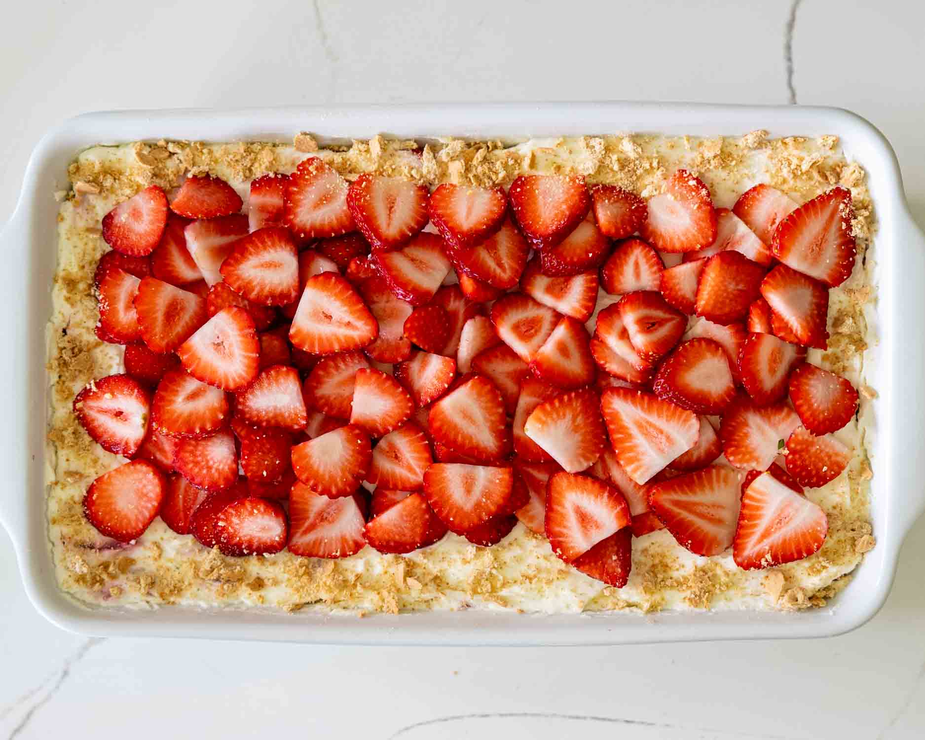 process shots showing how to make strawberry ice box cake.