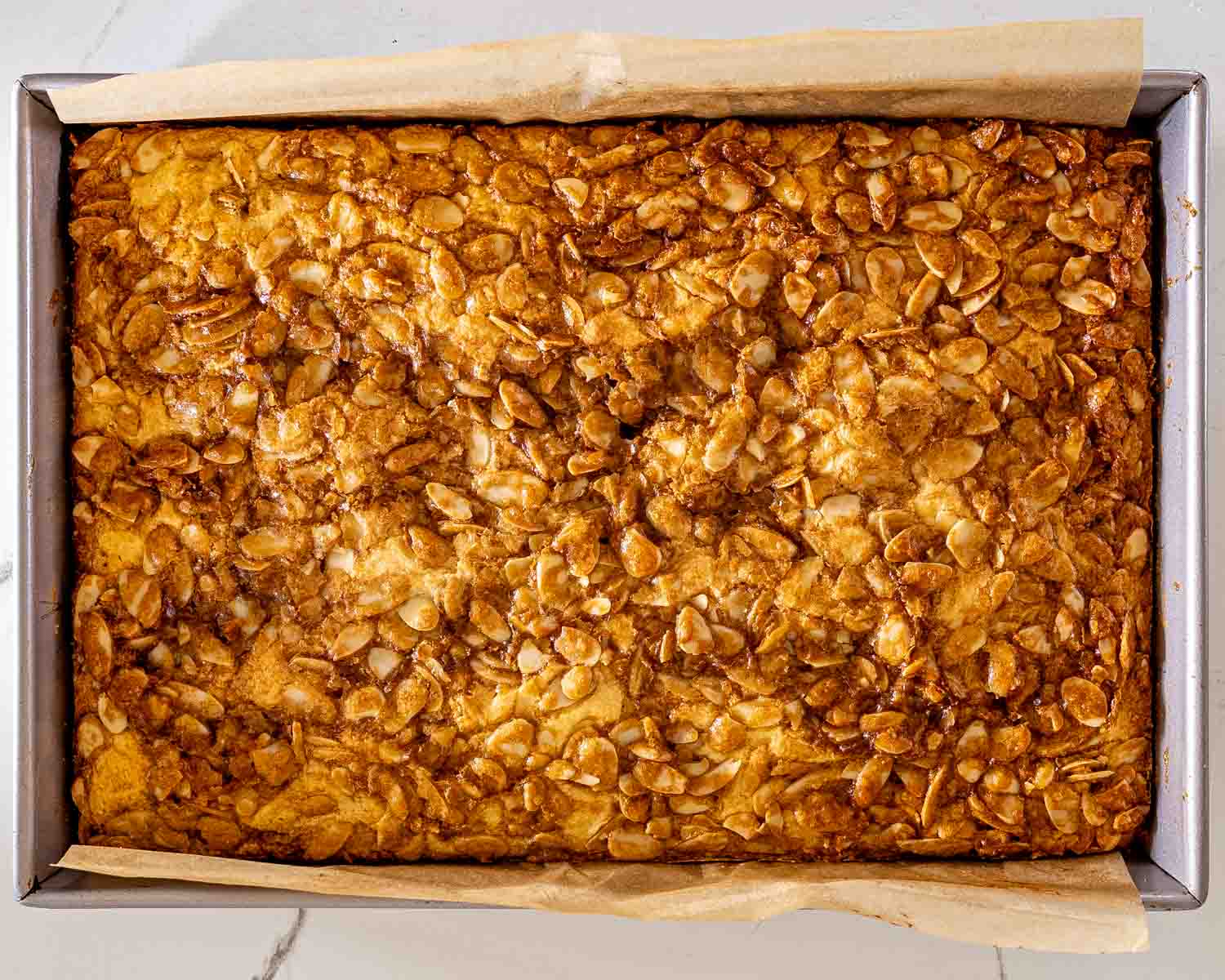process shots showing how to make almond croissant bars.