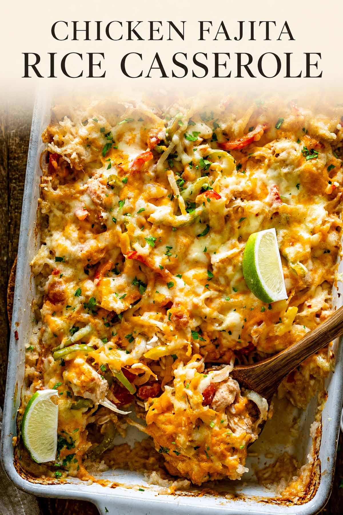 Pinterest image of cheesy chicken fajita rice casserole with colorful peppers, melted cheese, cilantro, lime wedges, and title text.