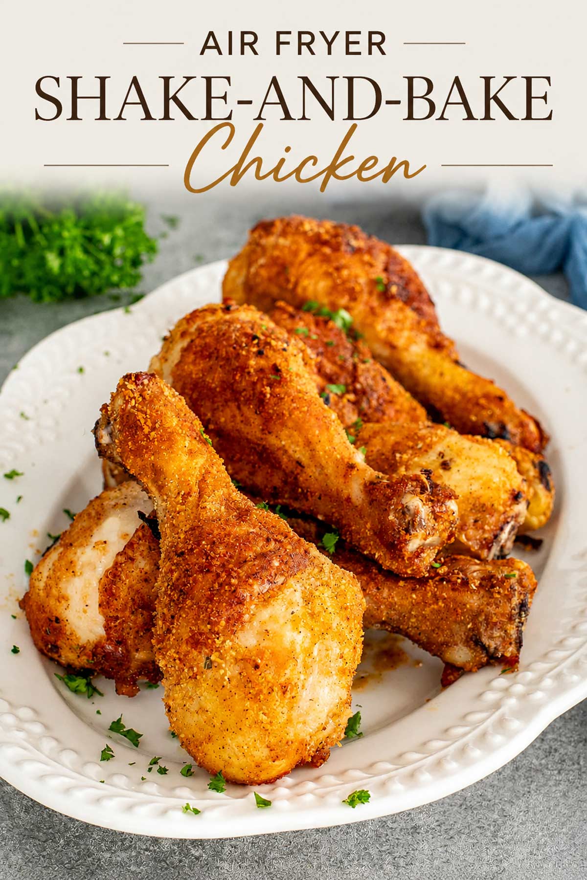 Pinterest graphic featuring crispy Air Fryer Shake-and-Bake Chicken with elegant recipe title overlay above a golden, crunchy chicken dinner.