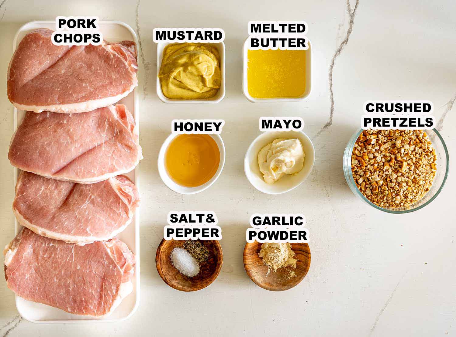 Labeled overhead display shows pork chops, Dijon mustard, honey, mayonnaise, melted butter, crushed pretzels, garlic powder, salt, and pepper.