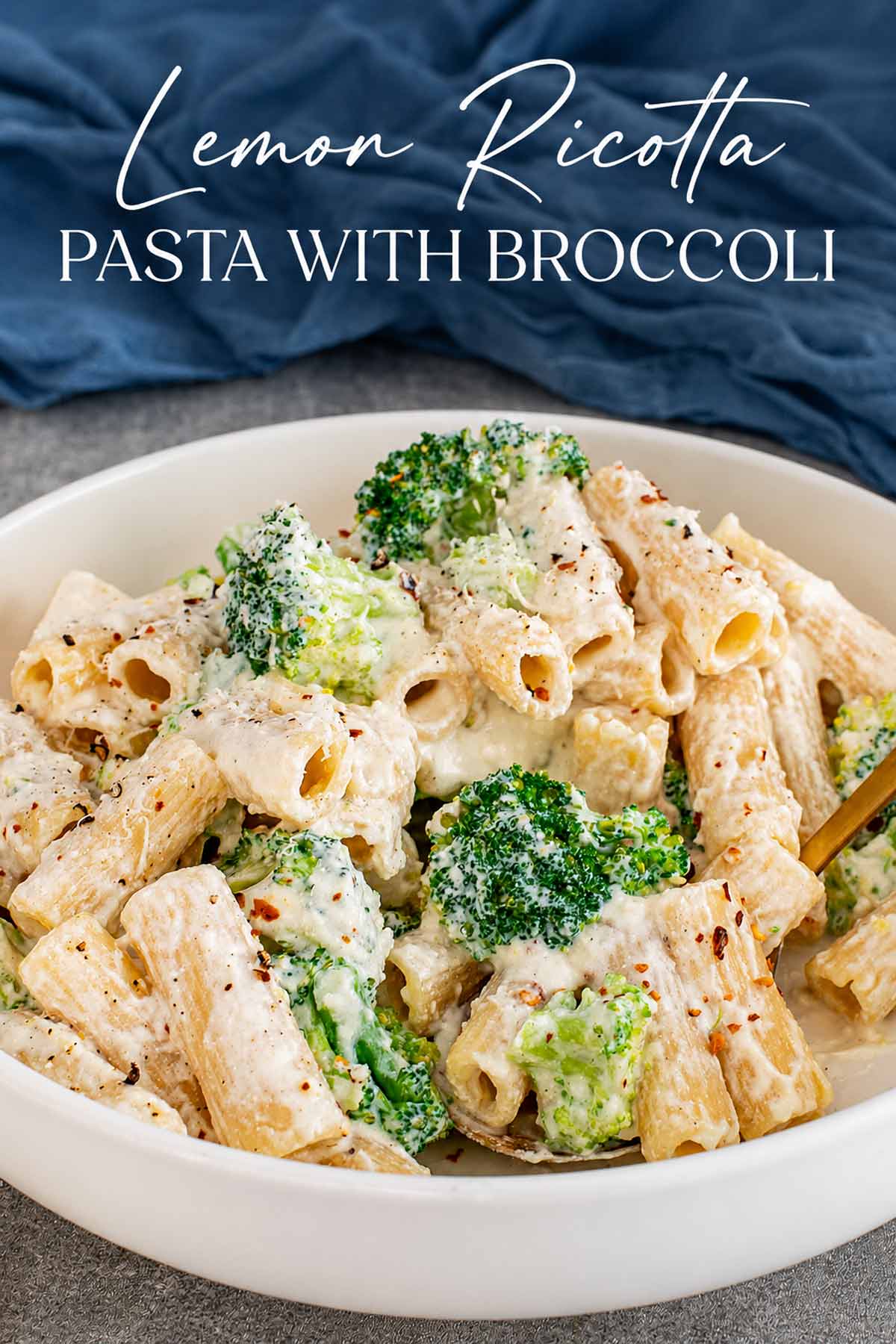 Pinterest graphic featuring creamy lemon ricotta pasta with broccoli in a white bowl beneath an elegant recipe title.