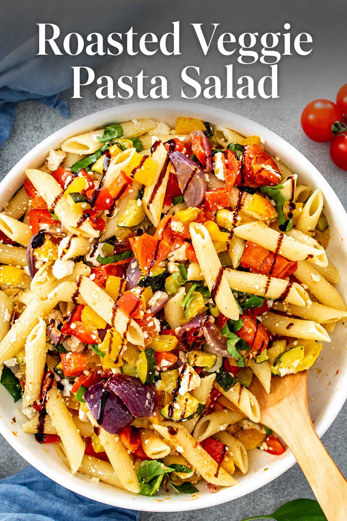 Roasted veggie pasta salad with penne, colorful vegetables, feta, basil, and balsamic glaze beneath an elegant recipe title.