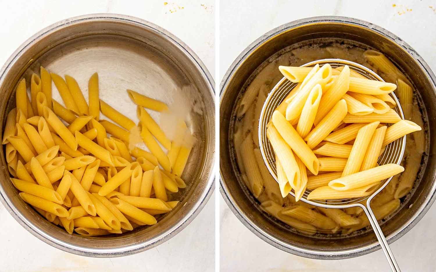 Penne pasta cooking in a large pot before being lifted from the water with a round wire strainer.