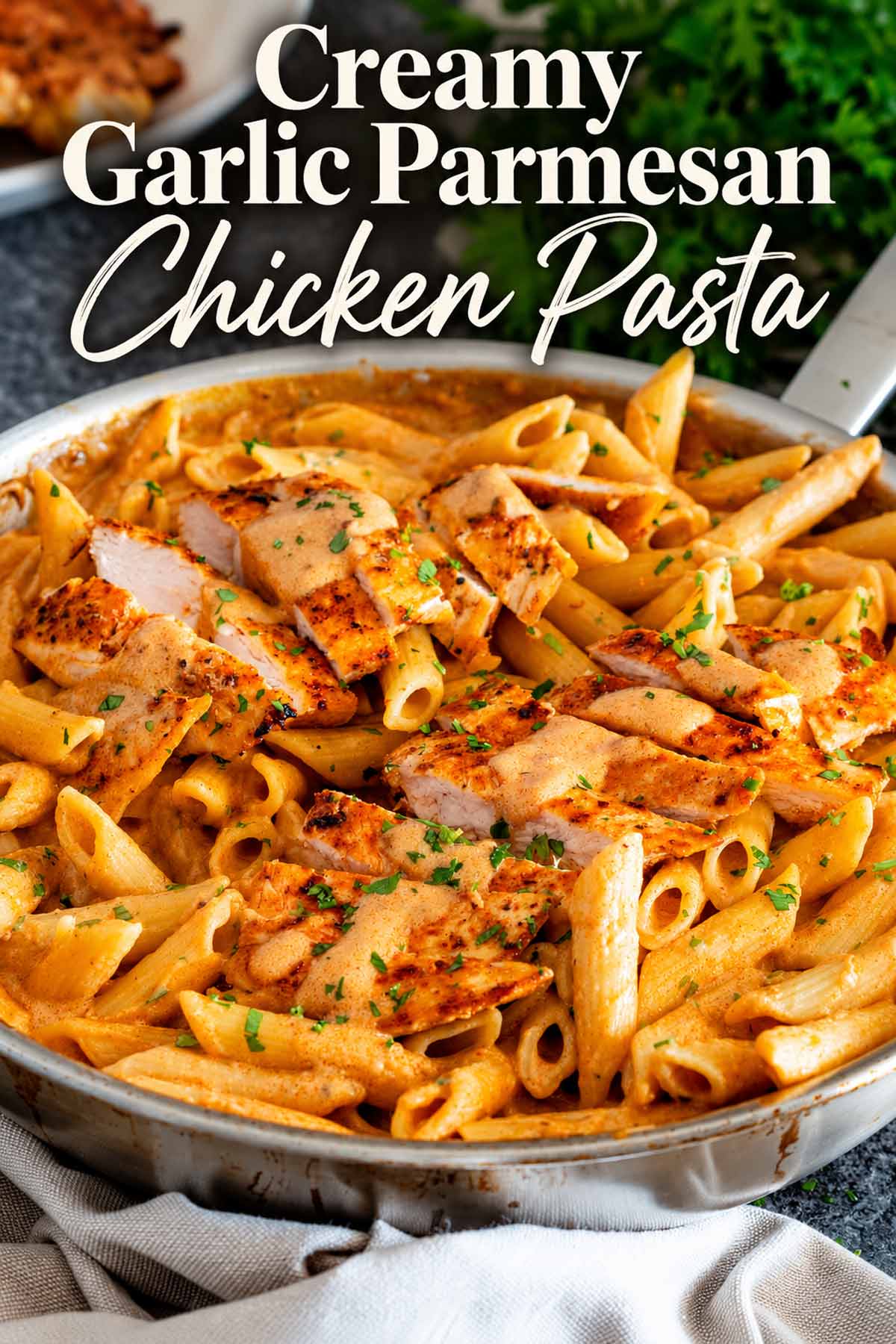 Pinterest graphic showing creamy garlic Parmesan chicken pasta with golden chicken, penne, parsley, and a stylish title overlay.