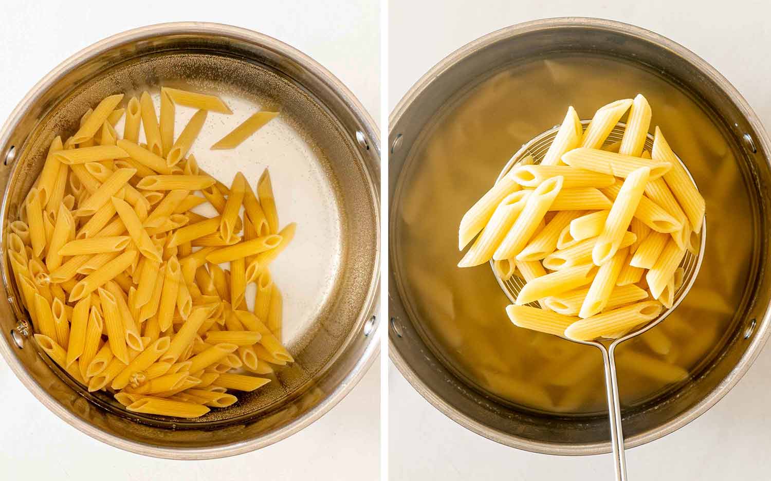 Penne pasta cooks in a pot of boiling water before being lifted out with a wire skimmer.