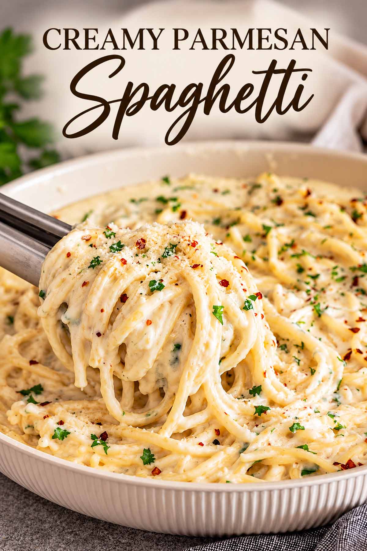 Pinterest graphic featuring creamy Parmesan spaghetti in a skillet with an elegant black recipe title displayed across the top.