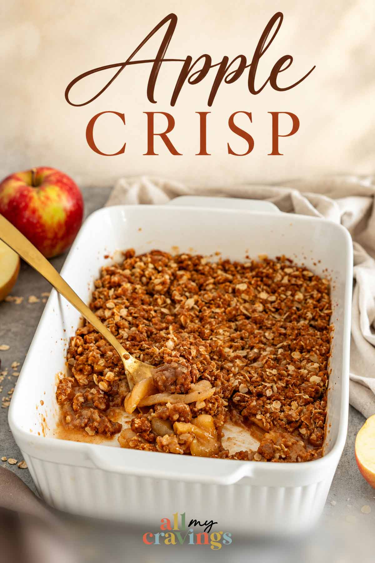 Pinterest graphic featuring golden apple crisp in a baking dish with an elegant title and the All My Cravings logo.