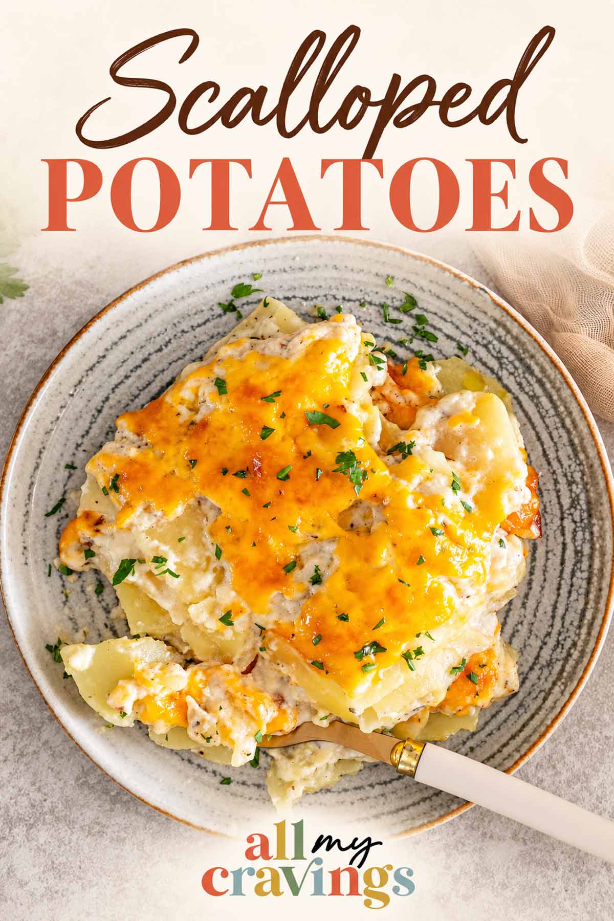 Pinterest graphic featuring cheesy scalloped potatoes on a plate with the Scalloped Potatoes title and All My Cravings logo.
