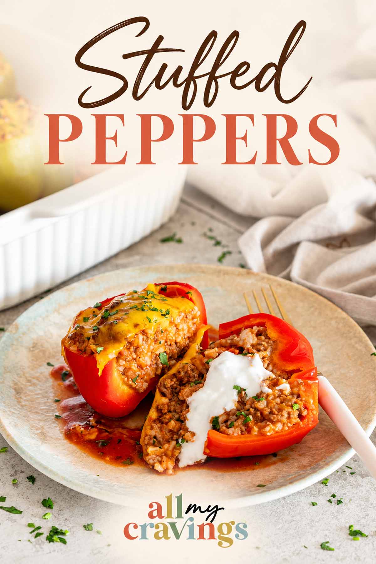 Pinterest graphic featuring sliced stuffed peppers with beef and rice filling, topped with cream and the recipe title.